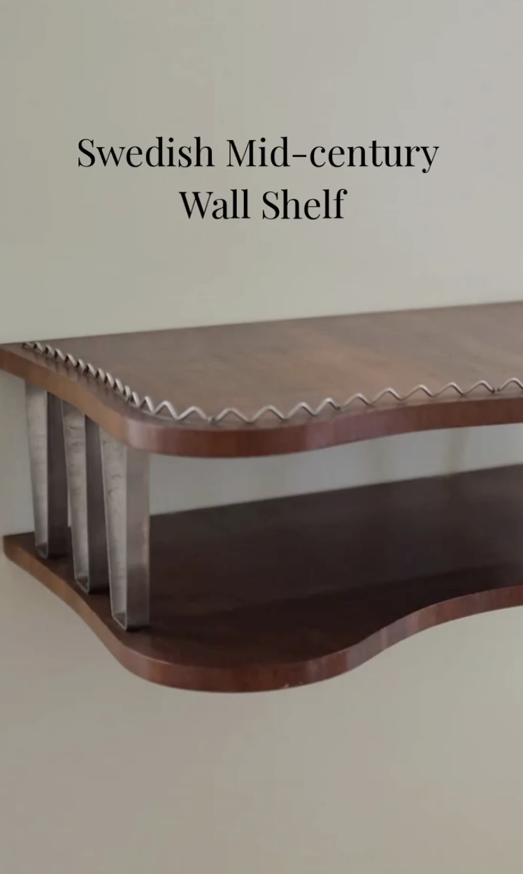 5. Swedish mid-century wall shelf with a wave-edged front