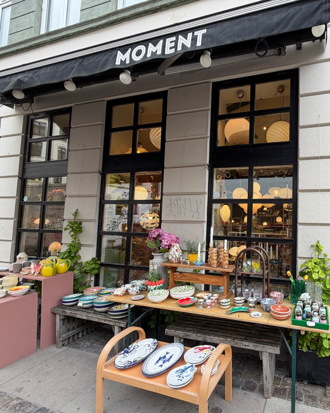 Moment KBH storefront with outdoor ceramics and tableware.