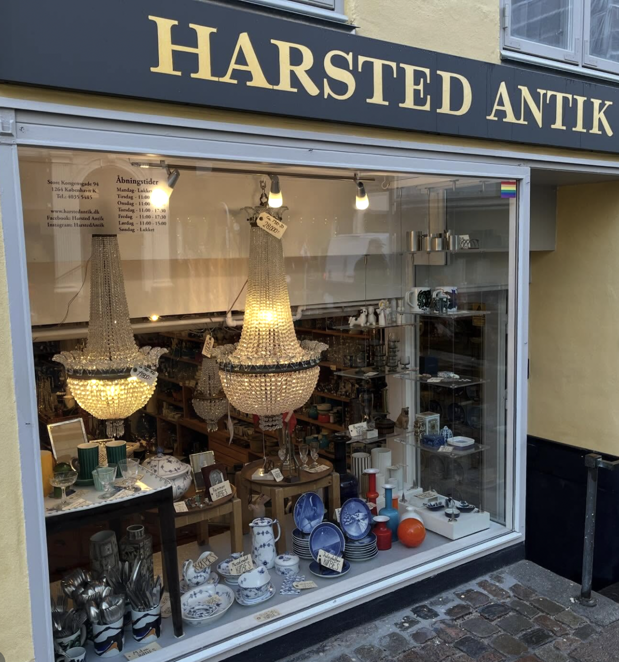 Harsted Antik storefront window with crystal chandeliers and tableware